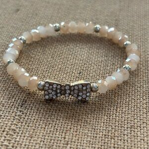 Pink Beads And Silver Tone Bow With Rhinestones Stretch Bracelet